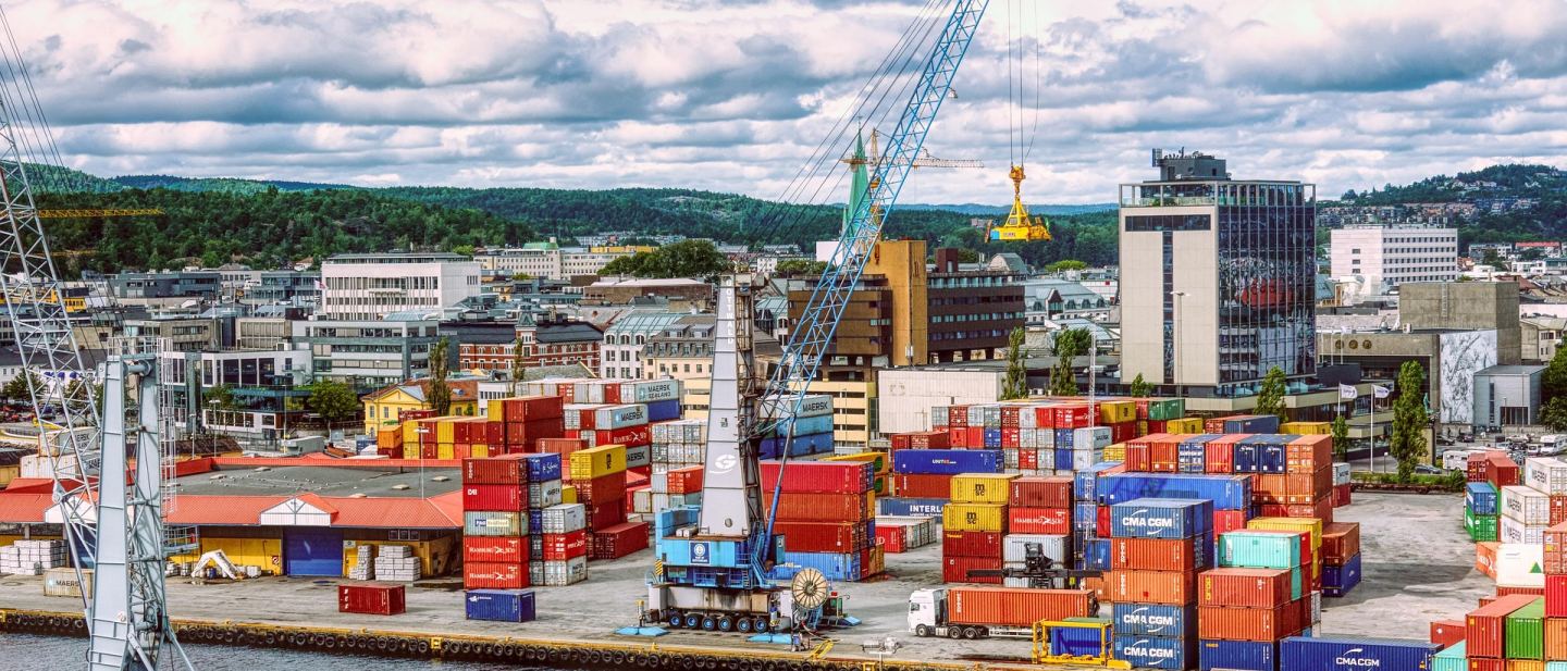 Port cranes and container handling equipment at an industrial cargo terminal