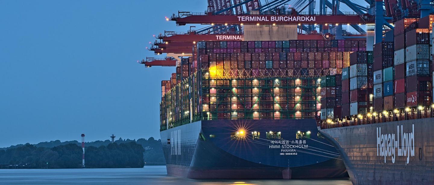 Container terminal with stacked containers and handling equipment in operation